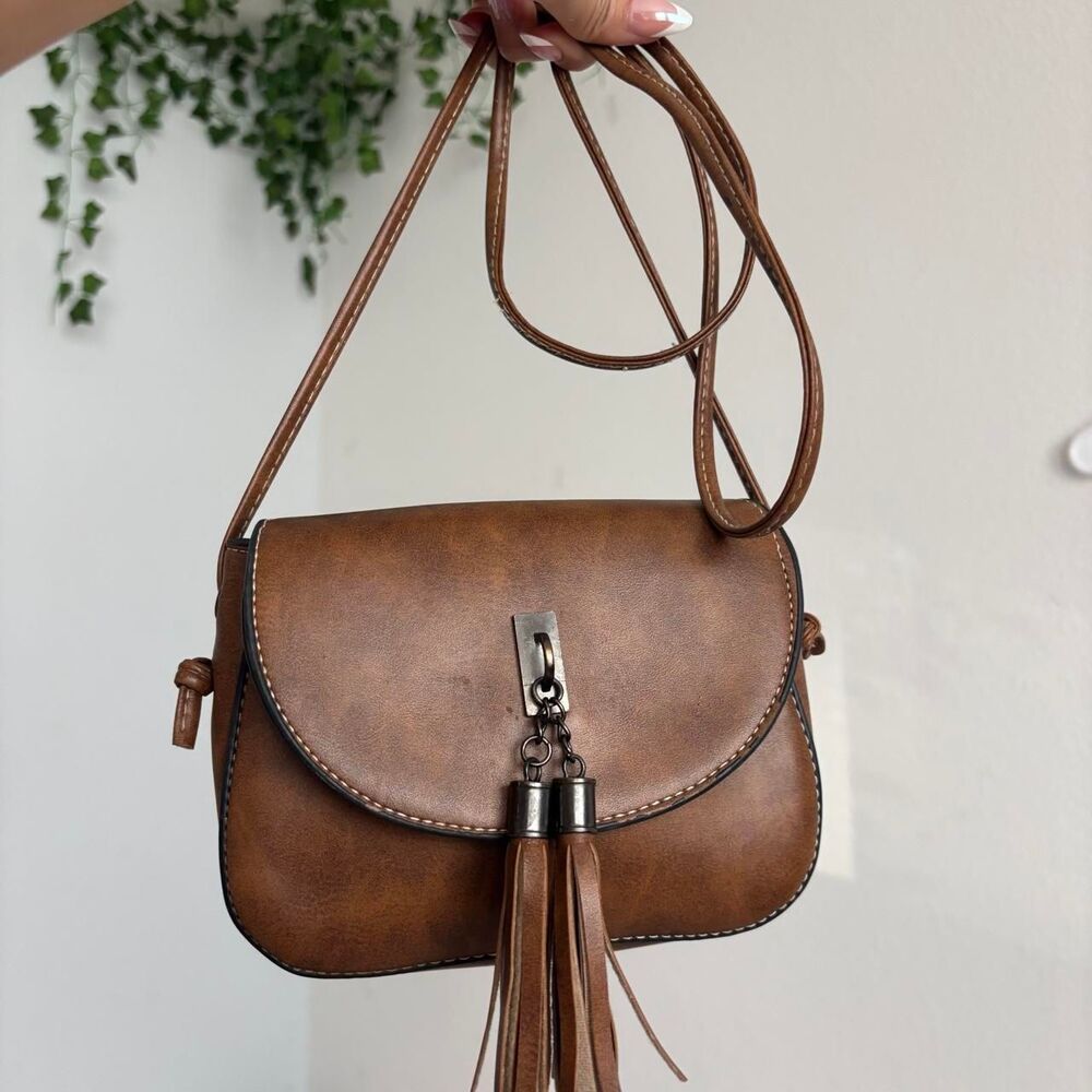 brown leather crossbody bag with tassel